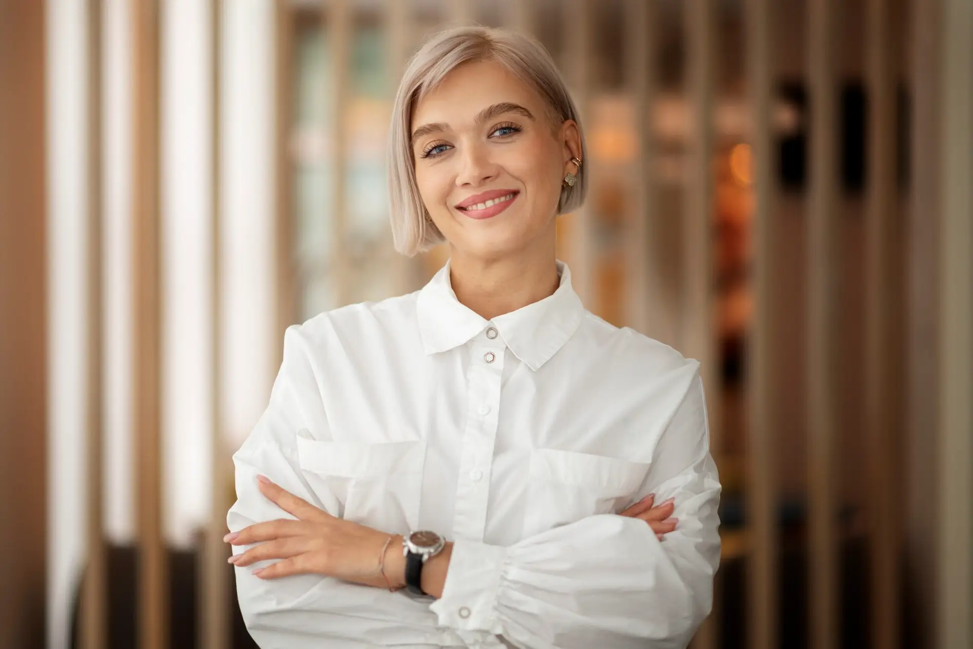 Smiling woman looking at the camera with a friendly expression.